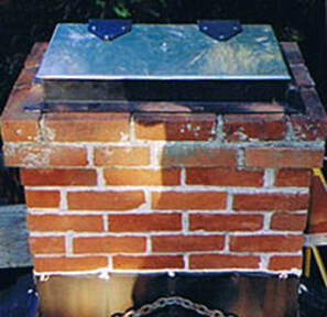 brick chimney with newly installed steel chimney top cover by Benson Energy
